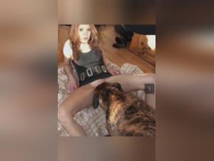 Red-haired woman and her dog: a hard zoophilia scene