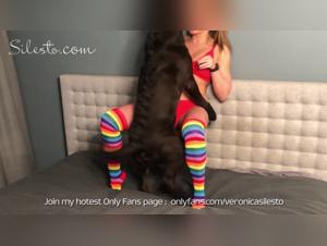 Veronica Silesto and her special canine friend at a Rainbow Party