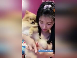 Asian woman and dog: a beastly video not to be missed