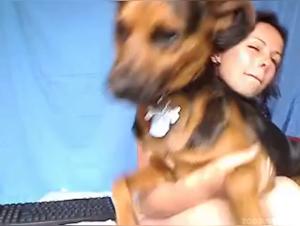 Beautiful brunette in a bestial sex video with a dog